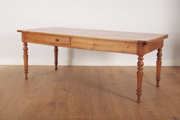 A FRUITWOOD DINING TABLE