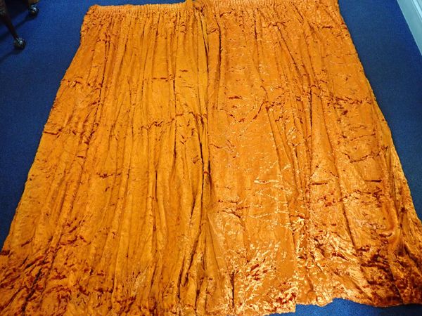 A PAIR OF OLD BURNT ORANGE PLUSH VELVET CURTAINS