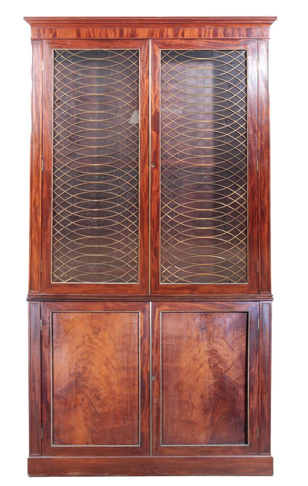 A GEORGE III FIGURED MAHOGANY BOOKCASE