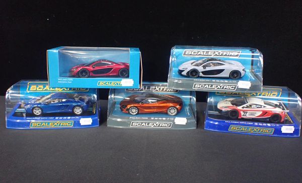 FIVE BOXED SCALEXTRIC 'McLAREN' CARS