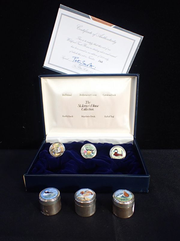 A SET OF SILVER AND ENAMEL PETER SCOTT WILDFOWL TRUST PILL BOXES