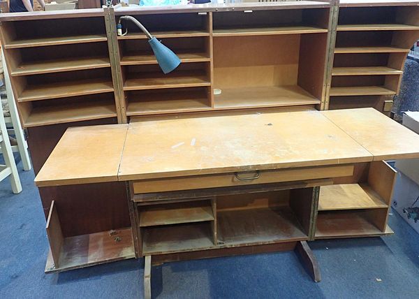 A VINTAGE SEWING CABINET