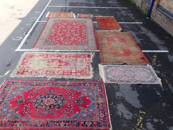 A QUANTITY OF VARIOUS RUGS