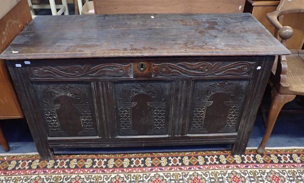 AN OAK PANELLED CHEST