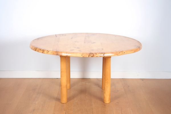 A LARGE CONTEMPORARY FIGURED ELM CIRCULAR TABLE