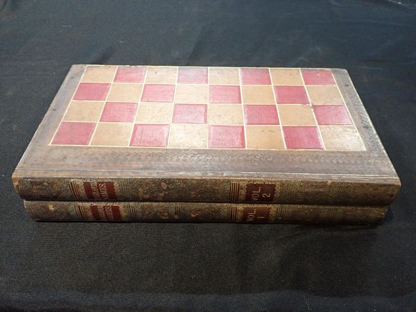 A CHESS/BACKGAMMON BOARD IN THE FORM OF TWO BOOKS