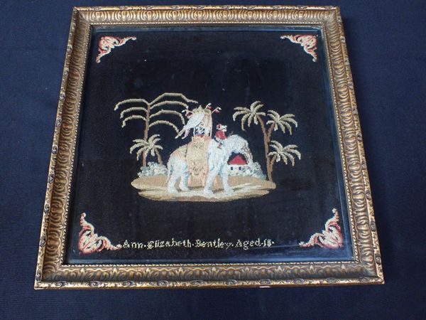 A VICTORIAN WOOL WORK PICTURE OF AN ELEPHANT