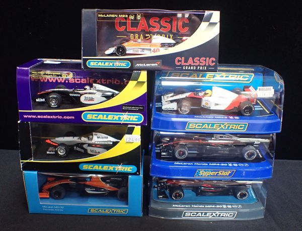 SEVEN BOXED SCALEXTRIC 'McLAREN' F1 CARS