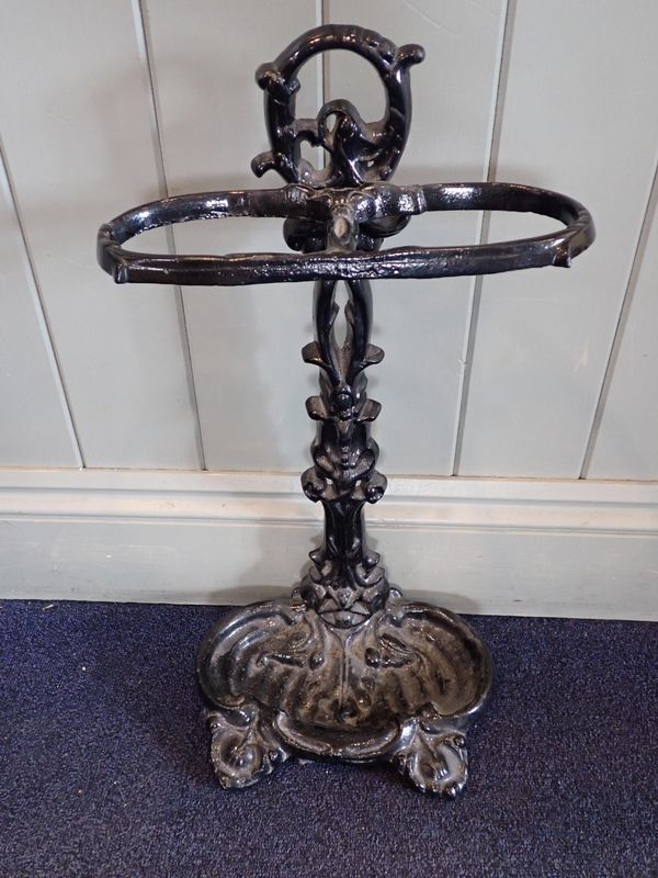 A VICTORIAN STYLE CAST IRON UMBRELLA STAND