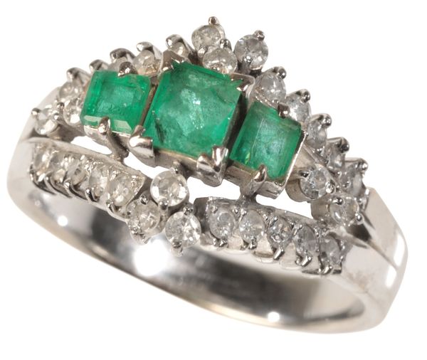 AN EMERALD AND DIAMOND DRESS RING