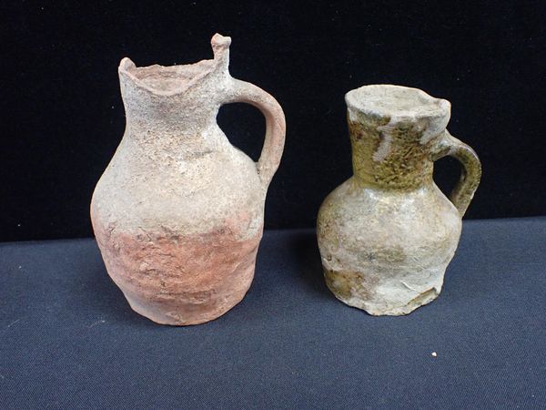 TWO EXCAVATED POTTERY JUGS, POSSIBLY MEDIEVAL