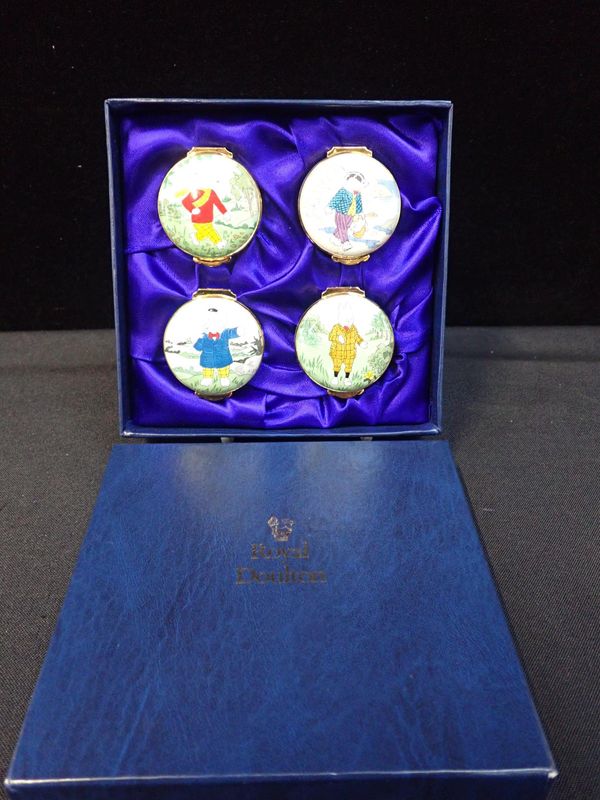 A SET OF FOUR CRUMMLES FOR ROYAL DOULTON ‘RUPERT CHARACTERS’ BOXES