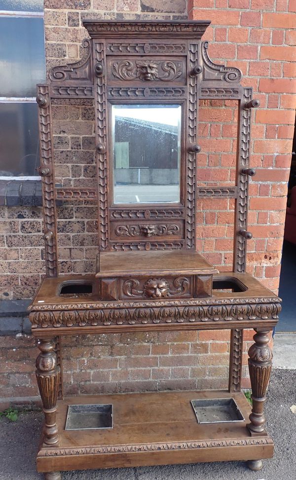 A VICTORIAN CARVED OAK HALL STAND