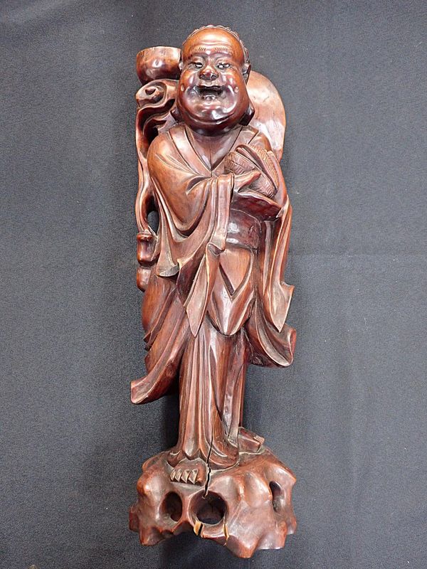A CHINESE CARVED HARDWOOD FIGURE