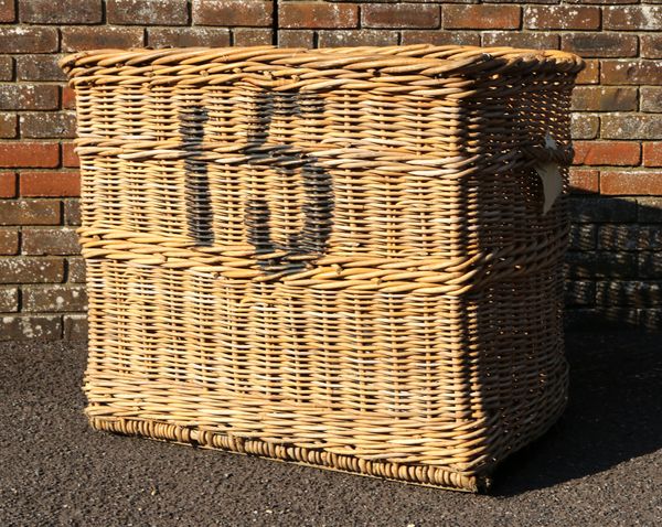 A LARGE COUNTRY HOUSE WICKER LOG BASKET