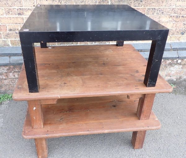 AN EBONISED COFFEE TABLE