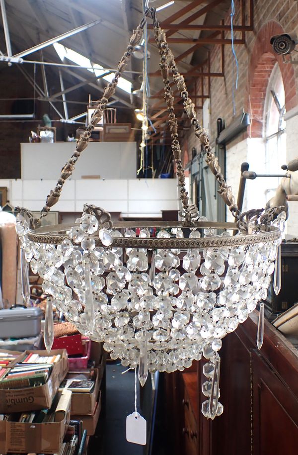 A FACETED GLASS BAG CHANDELIER WITH HEAVY GILDED CHAIN