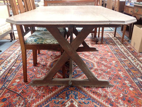 A GOTHIC REVIVAL OAK DINING TABLE IN THE STYLE OF A.W.N. PUGIN