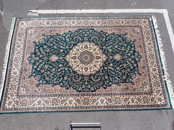 A PERSIAN DESIGN RUG , CENTRAL MEDALLION