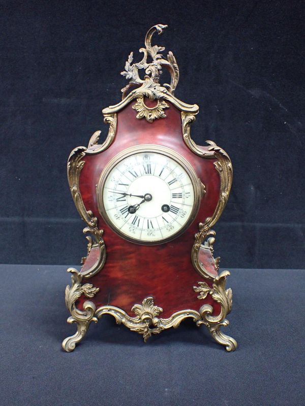 A 19TH CENTURY FRENCH TORTOISESHELL AND ORMOLU MANTEL CLOCK