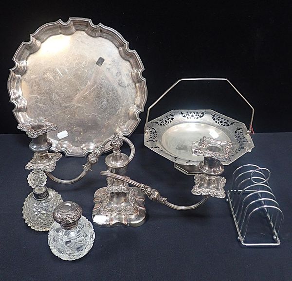 A SILVER-TOPPED CUT GLASS SCENT BOTTLE