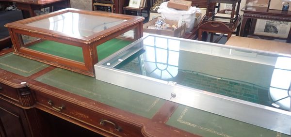 TWO GLAZED DISPLAY CASES, ONE ALUMINIUM