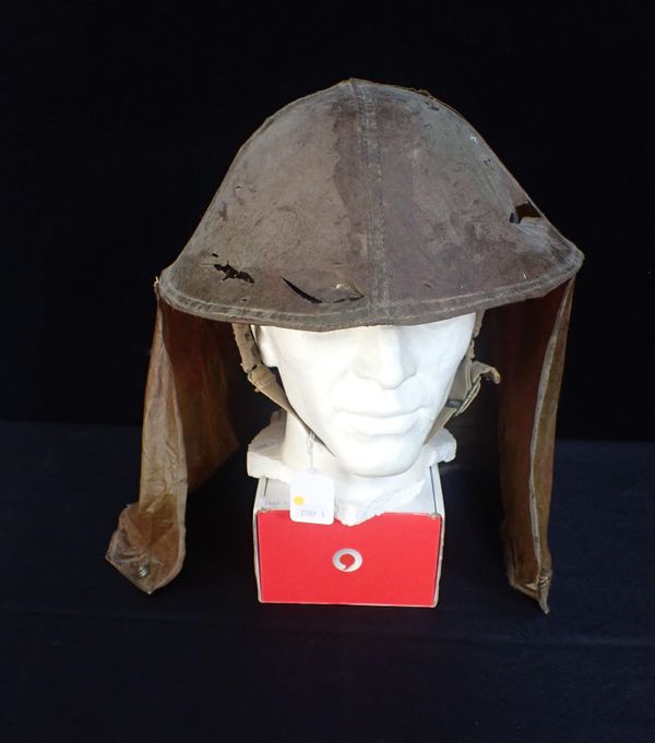 A CANADIAN RUBBERISED CAMOUFLAGE HELMET COVER