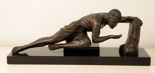 A BRONZE-EFFECT ART DECO STYLE SCULPTURE