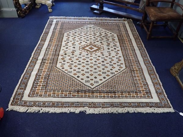 A CREAM GROUND RUG