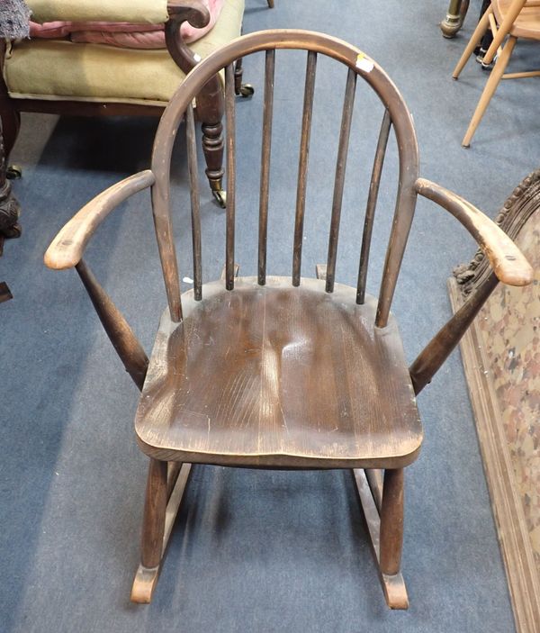 ERCOL: AN EARLY (UTILITY) WINDSOR ROCKING ARMCHAIR