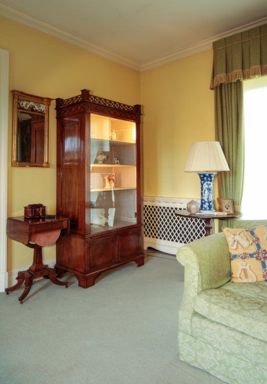 A PAIR OF GEORGE II STYLE MAHOGANY DISPLAY CABINETS