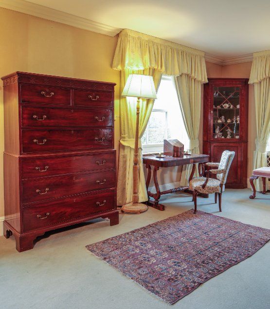 A NEAR PAIR OF GEORGE III MAHOGANY CHEST-ON-CHESTS