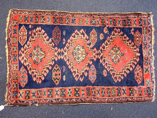 A SMALL PERSIAN DESIGN RUG