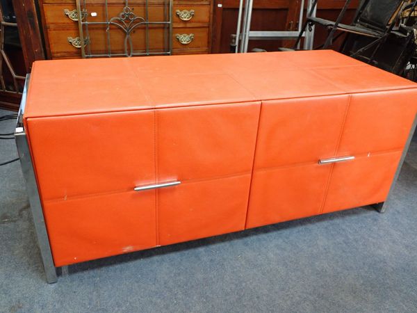 A CONTEMPORARY ORANGE LEATHERETTE COVERED CHEST