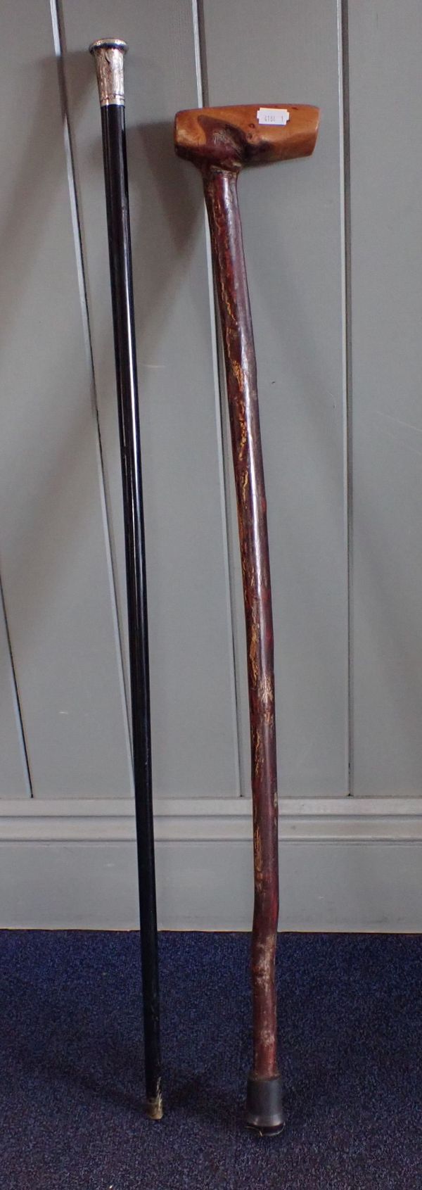 A HALLMARKED SILVER-TOPPED WALKING CANE