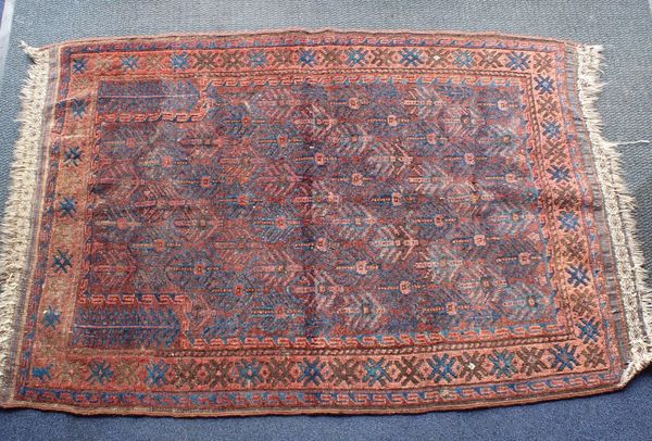 A BELUCH PRAYER RUG, BLUE AND RED