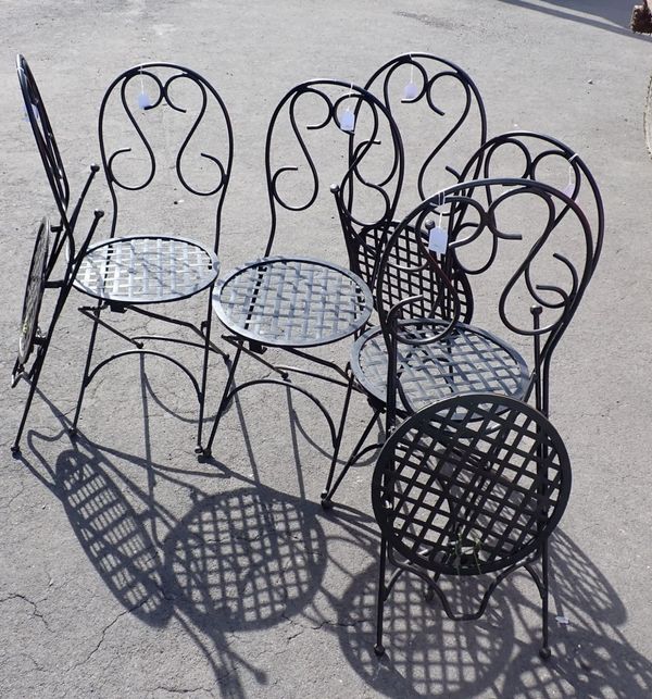 A SET OF SIX SCROLLING WROUGHT METAL GARDEN CHAIRS