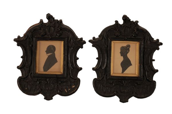 A PAIR OF PORTRAIT MINIATURES OF A LADY AND A GENTLEMAN