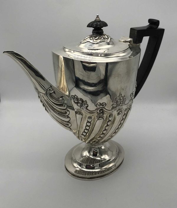 A LATE VICTORIAN SILVER COFFEE POT BY CHARLES STUART HARRIS,