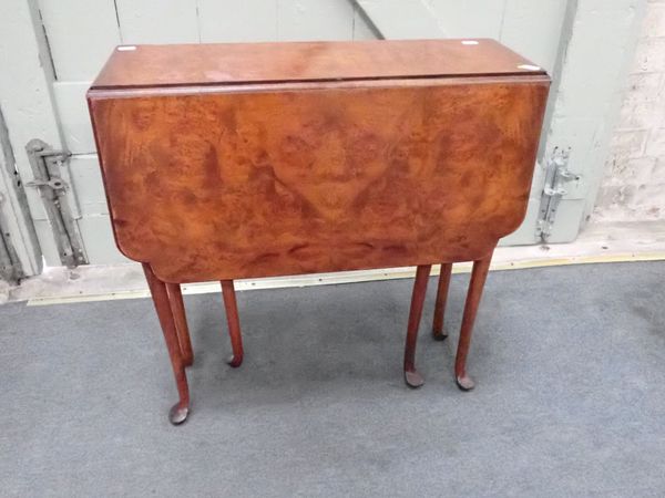 A REPRODUCTION QUEEN ANNE STYLE WALNUT TABLE