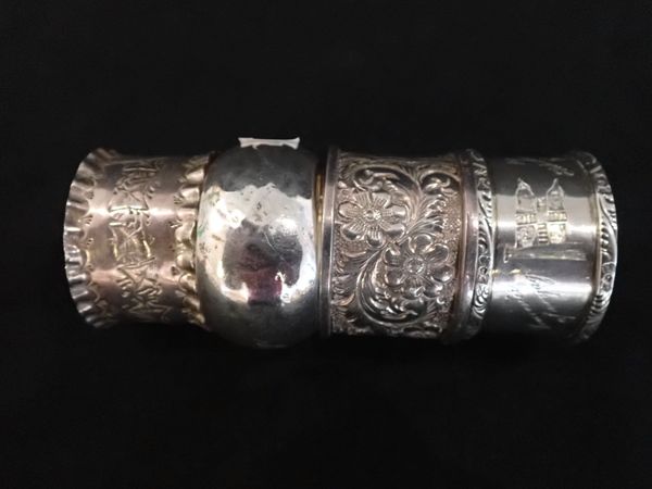 AN EDWARD VII EMBOSSED SILVER NAPKIN RING