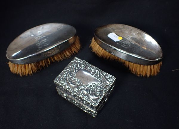 A PAIR OF SILVER BACKED BRUSHES