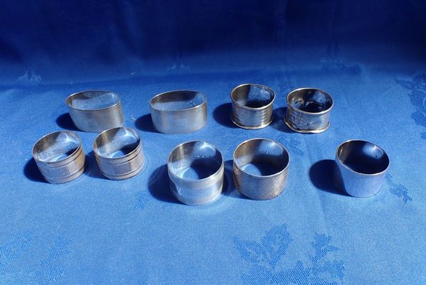 EIGHT SILVER NAPKIN RINGS