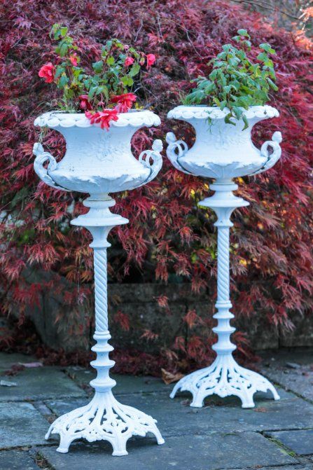 A PAIR OF COALBROOKDALE STYLE CAST IRON JARDINIERE