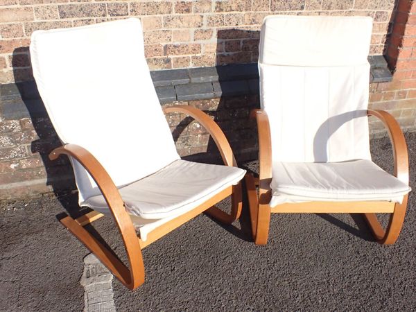 A PAIR OF MODERN LIGHT WOOD CANTILEVER ARMCHAIRS