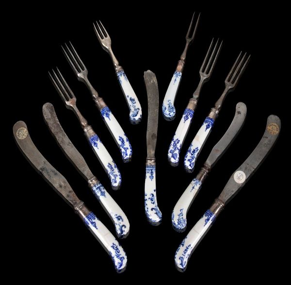 A PARIS, ST. CLOUD AND NEVERS COMPOSITE  SET OF PISTOL-SHAPED BLUE AND WHITE KNIFE HANDLES