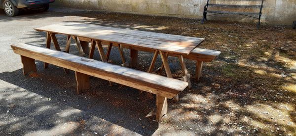 A PINE TABLE AND A PAIR OF PINE BENCHES, LATE 19TH OR EARLY 20TH CENTURY,