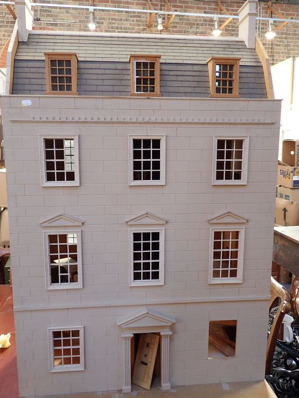 A LARGE  'CRESCENT' DOLLS HOUSE, IN THE GEORGIAN STYLE
