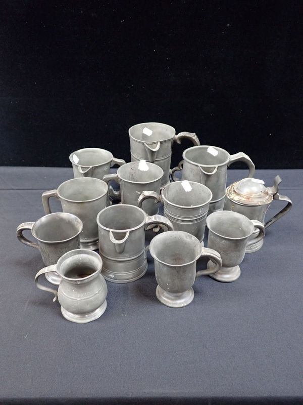 A COLLECTION OF PEWTER PUB TANKARDS