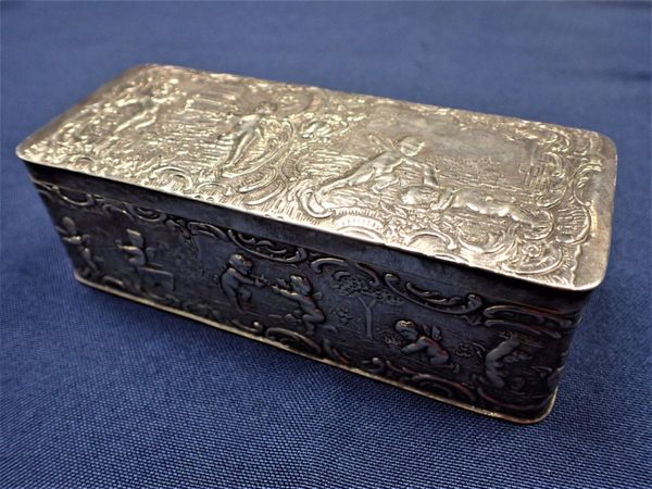 A REPOUSSE SILVER BOX